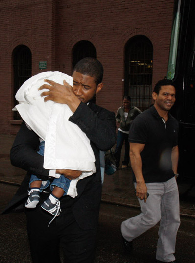 Usher brings family to work.